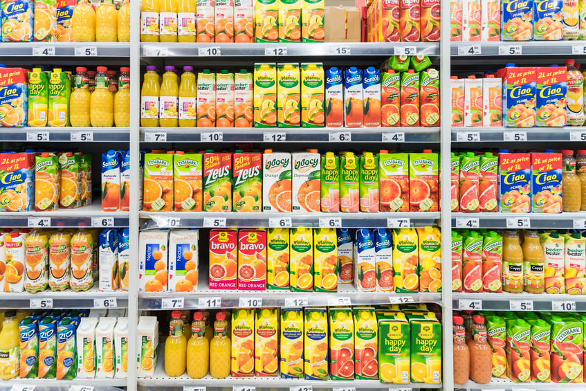 37711699 - bucharest, romania - march 15, 2015: orange soda juice bottles on supermarket stand.