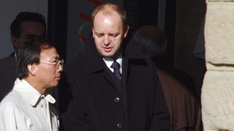 The Vice-president of Korean car maker Hyundai Motors, Kim Dong Jin (L) speaks with Slovakia's Minister of Industry Pavol Rusko (R) as they meet in the northern Slovak town of Zilina, 17 October 2003 where the Korean delegation led by Kim Dong Jin arrived from the Czech Republic to examine properties for their future car-plant. Hyundai Motors is deciding between locations in the Czech republic, Slovakia, Poland and Hungary and is planning to invest 1.5 billion euros in a plant that will produce up to 300 000 cars per year. AFP PHOTO/JOE KLAMAR (Photo by JOE KLAMAR / AFP)