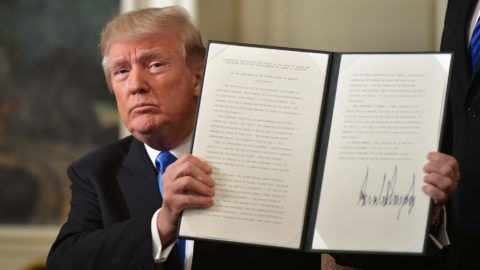 US President Donald Trump holds up a signed memorandum after he delivered a statement on Jerusalem from the Diplomatic Reception Room of the White House in Washington, DC on December 6, 2017. President Donald Trump on Wednesday recognized the disputed city of Jerusalem as Israel's capital -- a historic decision that overturns decades of US policy and risks triggering a fresh spasm of violence in the Middle East.