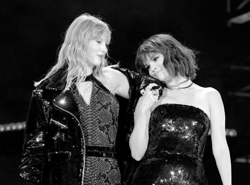 PASADENA, CA - MAY 19: (EDITORS NOTE: Image has been converted to black and white.) Taylor Swift and Selena Gomez perform onstage during the Taylor Swift reputation Stadium Tour at the Rose Bowl on May 19, 2018 in Pasadena, California (Photo by Christopher Polk/TAS18/Getty Images)