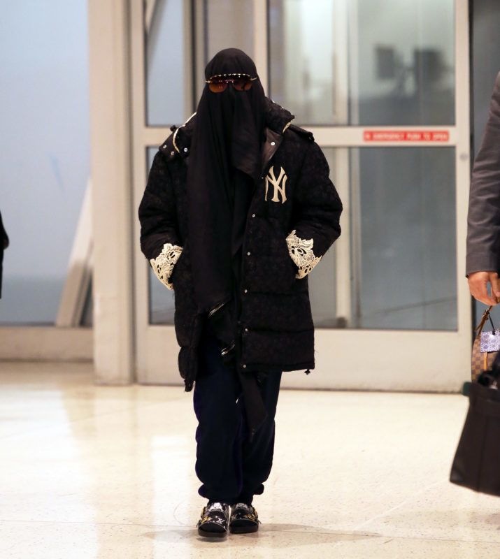 05/06/2019 EXCLUSIVE: Madonna tries to go incognito while departing out of JFK airport in New York. The 60 year old singer who just announced her 'Madame X' tour wore a black burka, New York Yankees jacket with lace trim, black sweats, and Louis Vuitton sandals. sales@theimagedirect.com Please byline:TheImageDirect.com *EXCLUSIVE PLEASE EMAIL sales@theimagedirect.com FOR FEES BEFORE USE May 6, 2019