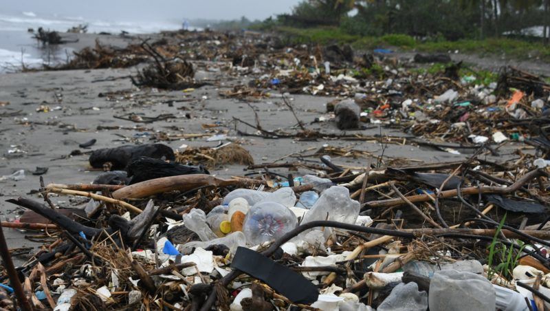 View of garbage at Omoa beach, Cortes department, Honduras, on November 11, 2017. Floating masses of garbage offshore from some of the Caribbean's pristine beaches are testimony to a vast and growing problem of plastic pollution heedlessly dumped in our oceans, locals, activists and experts say. / AFP PHOTO / ORLANDO SIERRA / TO GO WITH AFP STORY by NOE LEIVA