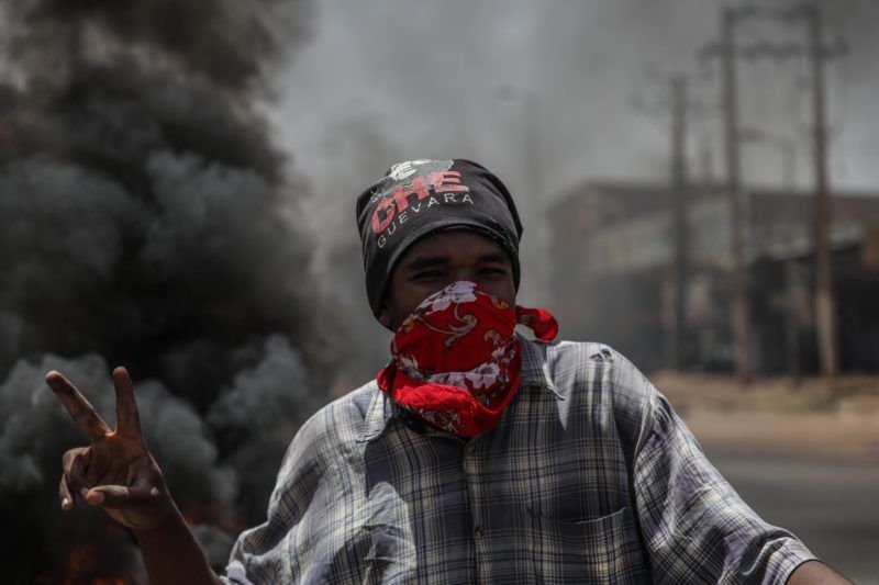 KHARTOUM, SUDAN - JUNE 03 : Sudanese protesters burn tyres and set up barricades on roads to army headquarters after the intervention of Sudanese army, during a demonstration in Khartoum, Sudan on June 3, 2019. At least 13 protesters were killed and hundreds injured on Monday as Sudanese security forces moved in to clear the main protest camp near the army headquarters in the capital Khartoum, according to protest organizers. Mahmoud Hjaj / Anadolu Agency