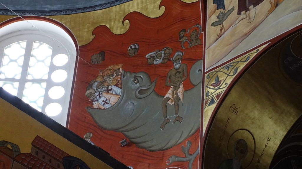 A pokolban égő Tito, Marx és Engels díszíti egy montenegrói templom falát